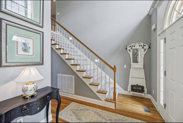 5122 Stonewood Dr, Smyrna, TN 37167 - foyer entrance featuring a towering ceiling, stairway, wood finished floors, and plenty of natural light
