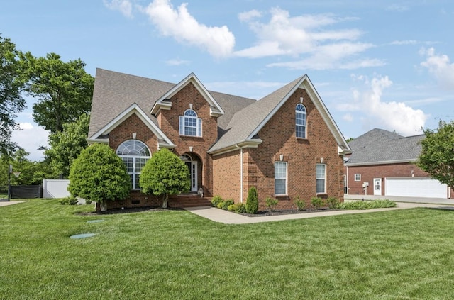 5122 Stonewood Dr, Smyrna, TN 37167 - traditional-style house with brick siding, a front yard, and roof with shingles