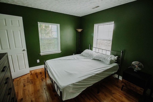 800 Riverside Dr, Columbia, TN 38401 - bedroom featuring wood finished floors, baseboards, and a textured ceiling