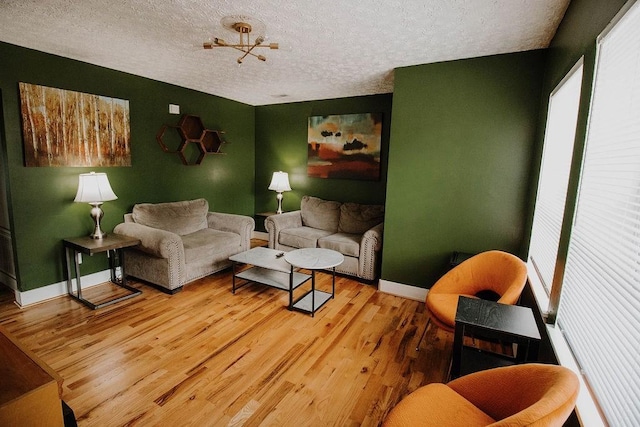 800 Riverside Dr, Columbia, TN 38401 - living area featuring a textured ceiling, wood finished floors, and baseboards