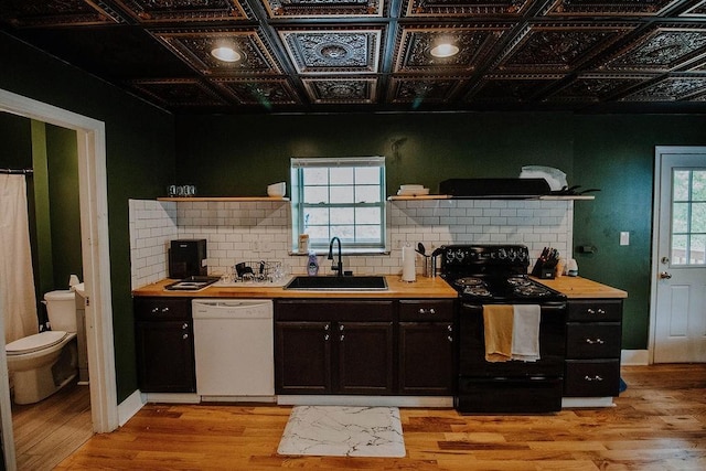 800 Riverside Dr, Columbia, TN 38401 - kitchen featuring black range with electric cooktop, open shelves, a sink, white dishwasher, and tasteful backsplash