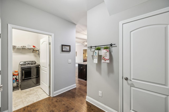 1420 Whispering Oaks Dr, Lebanon, TN 37090 - hall featuring washer / dryer, dark wood-type flooring, and baseboards