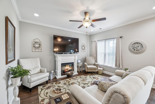 1420 Whispering Oaks Dr, Lebanon, TN 37090 - living area featuring wood finished floors, a glass covered fireplace, ceiling fan, recessed lighting, and crown molding