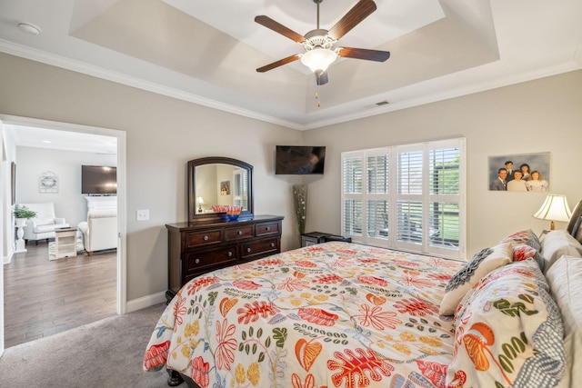 1420 Whispering Oaks Dr, Lebanon, TN 37090 - bedroom featuring a tray ceiling, crown molding, carpet flooring, baseboards, and a ceiling fan