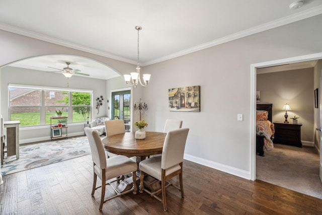1420 Whispering Oaks Dr, Lebanon, TN 37090 - dining area featuring arched walkways, dark wood-type flooring, baseboards, a ceiling fan, and crown molding
