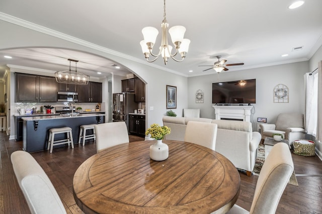 1420 Whispering Oaks Dr, Lebanon, TN 37090 - dining area featuring arched walkways, a chandelier, recessed lighting, ceiling fan, and dark wood finished floors