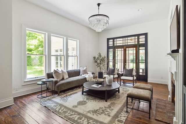 1051 W Main St, Franklin, TN 37064 - living room featuring baseboards, a chandelier, and dark wood finished floors