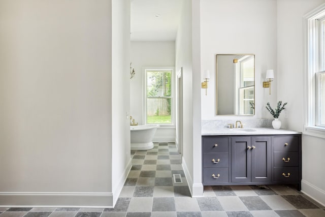 1051 W Main St, Franklin, TN 37064 - full bathroom featuring baseboards, vanity, and a freestanding bath