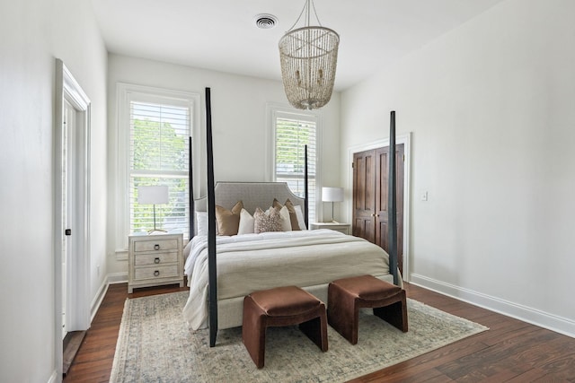 1051 W Main St, Franklin, TN 37064 - bedroom featuring a chandelier, dark wood-type flooring, and baseboards