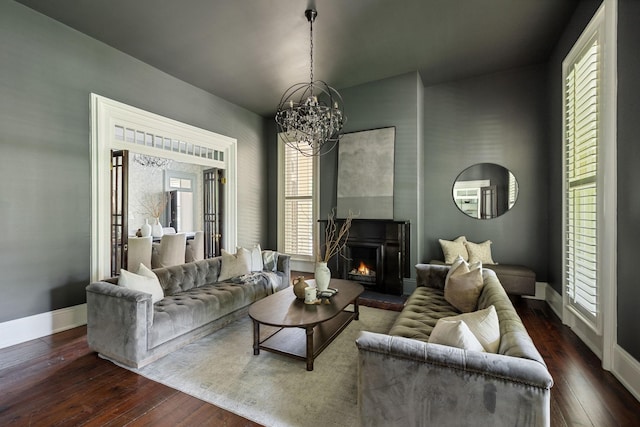 1051 W Main St, Franklin, TN 37064 - living area featuring baseboards, hardwood / wood-style floors, a chandelier, and a lit fireplace