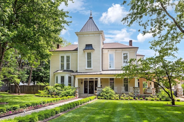 1051 W Main St, Franklin, TN 37064 - victorian home with a standing seam roof, metal roof, a chimney, and covered porch