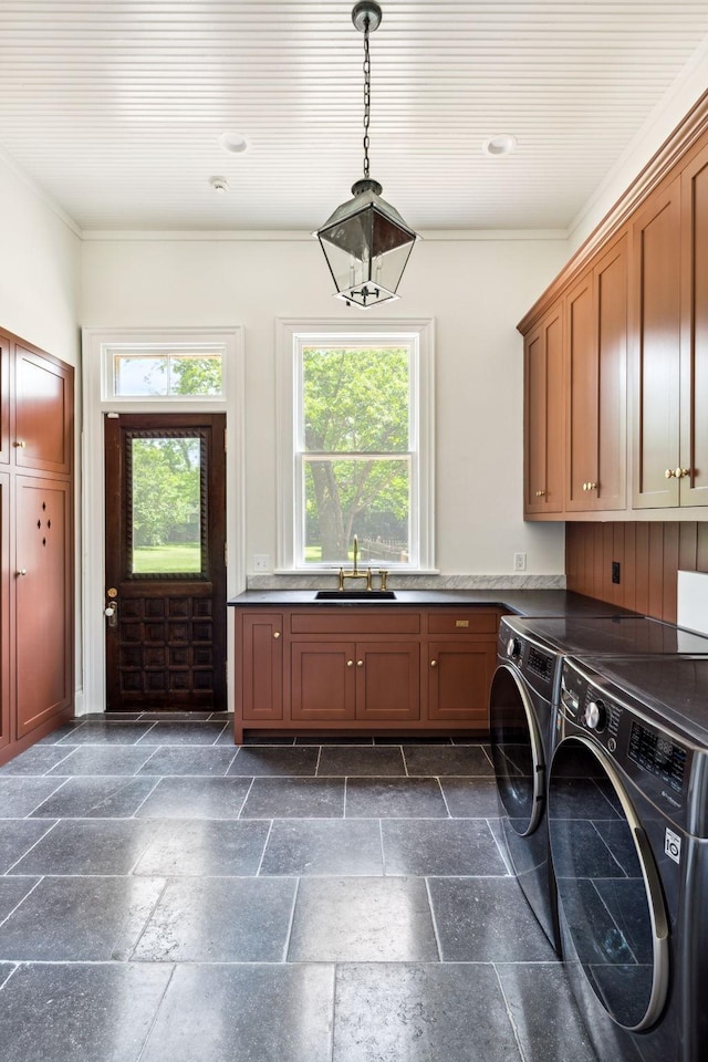 1051 W Main St, Franklin, TN 37064 - laundry room featuring cabinet space, washer and clothes dryer, plenty of natural light, stone tile floors, and crown molding