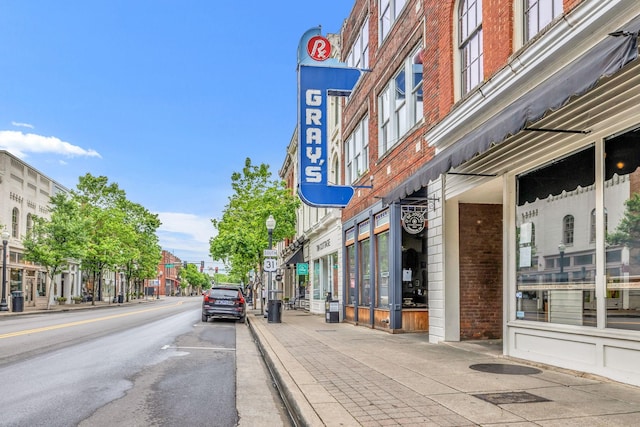 1051 W Main St, Franklin, TN 37064 - view of asphalt street featuring sidewalks, curbs, street lighting, and traffic signs