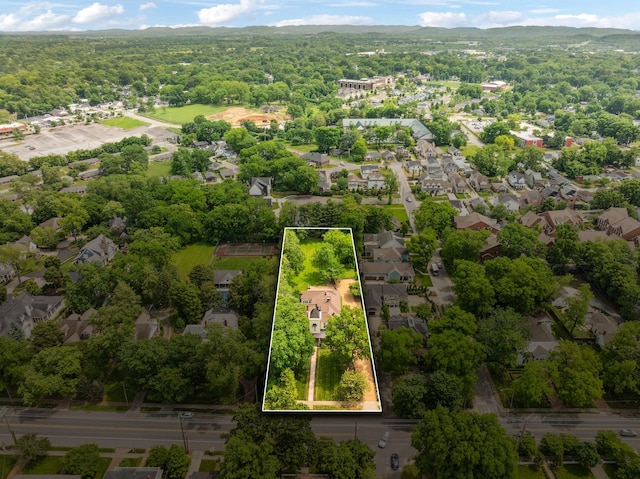 1051 W Main St, Franklin, TN 37064 - aerial perspective of suburban area featuring property boundaries highlighted and a heavily wooded area