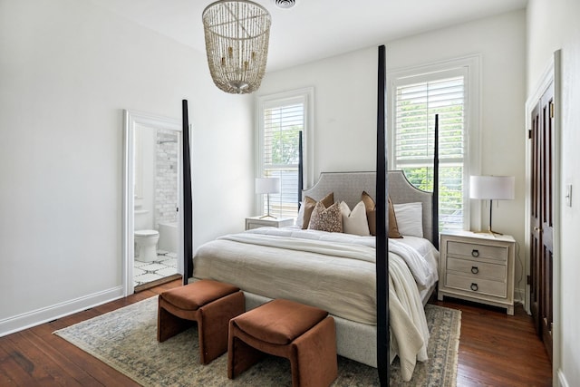 1051 W Main St, Franklin, TN 37064 - bedroom with dark wood-style flooring, a chandelier, ensuite bath, and baseboards