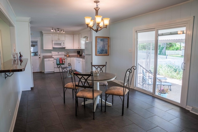 4011 Sheddan Dr, Columbia, TN 38401 - dining space with a chandelier, baseboards, and crown molding