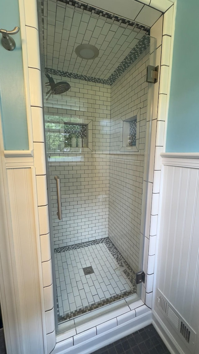 4011 Sheddan Dr, Columbia, TN 38401 - bathroom featuring a shower stall, wainscoting, and tile patterned floors