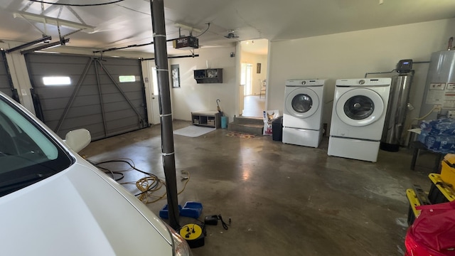 4011 Sheddan Dr, Columbia, TN 38401 - garage featuring water heater, washer and clothes dryer, and a garage door opener
