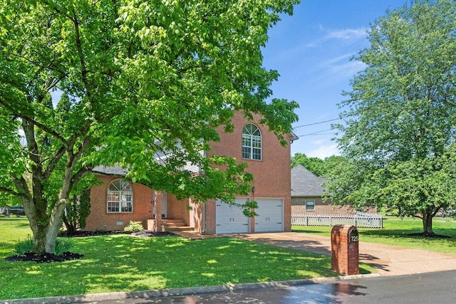 125 Wembly Ct, Franklin, TN 37067 - view of front facade featuring concrete driveway, brick siding, an attached garage, and crawl space