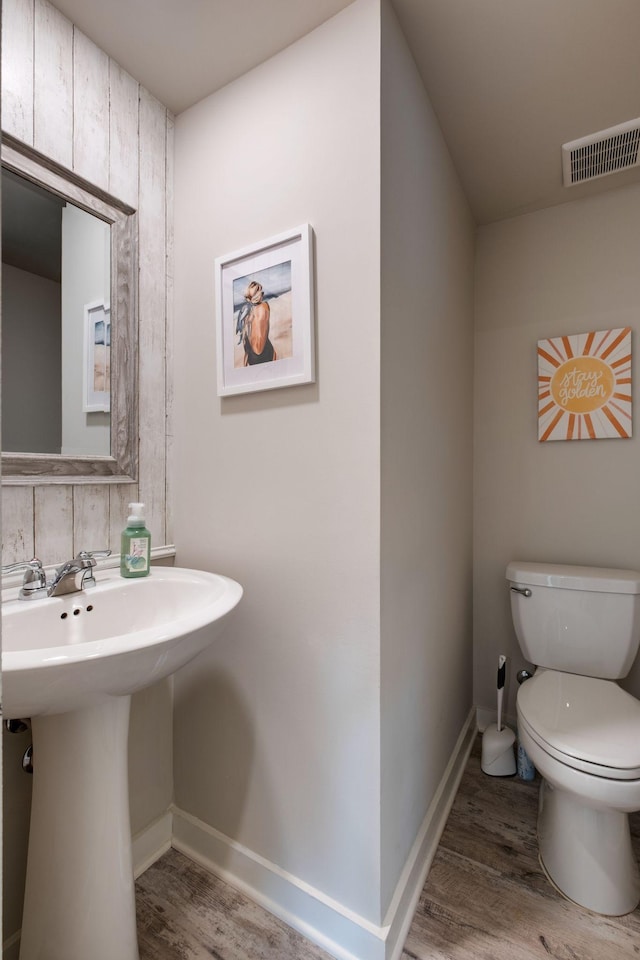308 Whisper Wood Way, Lebanon, TN 37087 - bathroom with wood finished floors, toilet, baseboards, and a sink