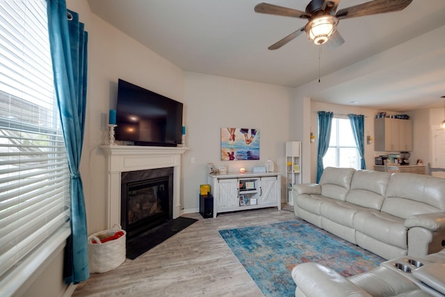308 Whisper Wood Way, Lebanon, TN 37087 - living area featuring a ceiling fan, a premium fireplace, and light wood finished floors