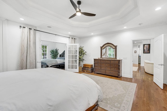 6948 Whispering Oaks Dr, Springfield, TN 37172 - bedroom featuring ornamental molding, a tray ceiling, wood finished floors, recessed lighting, and a ceiling fan