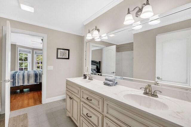 6948 Whispering Oaks Dr, Springfield, TN 37172 - full bathroom with ensuite bathroom, tile patterned floors, double vanity, crown molding, and baseboards