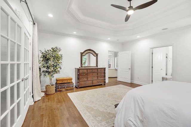 6948 Whispering Oaks Dr, Springfield, TN 37172 - bedroom featuring a raised ceiling, crown molding, wood finished floors, recessed lighting, and a ceiling fan
