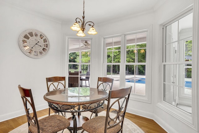 6948 Whispering Oaks Dr, Springfield, TN 37172 - dining space with a chandelier, plenty of natural light, wood finished floors, ornamental molding, and baseboards