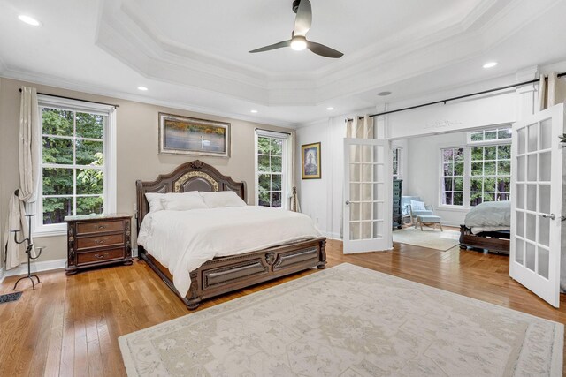 6948 Whispering Oaks Dr, Springfield, TN 37172 - bedroom with ornamental molding, multiple windows, a tray ceiling, hardwood / wood-style floors, and recessed lighting