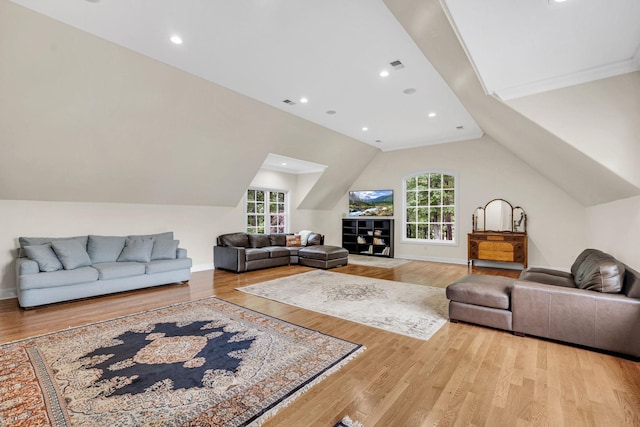 6948 Whispering Oaks Dr, Springfield, TN 37172 - living area with healthy amount of natural light, wood finished floors, vaulted ceiling, baseboards, and recessed lighting
