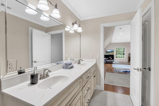 6948 Whispering Oaks Dr, Springfield, TN 37172 - full bathroom with double vanity, tile patterned flooring, crown molding, ensuite bathroom, and baseboards