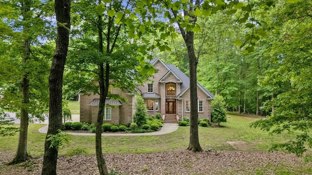 6948 Whispering Oaks Dr, Springfield, TN 37172 - view of front of house featuring a front lawn and brick siding
