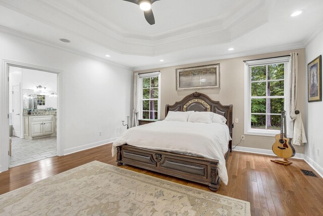 6948 Whispering Oaks Dr, Springfield, TN 37172 - bedroom featuring ornamental molding, wood-type flooring, ensuite bathroom, a ceiling fan, and baseboards