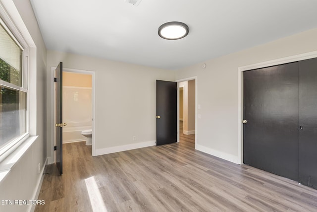 17 Westover Dr, Oak Ridge, TN 37830 - unfurnished bedroom with light wood finished floors, a closet, baseboards, and ensuite bath
