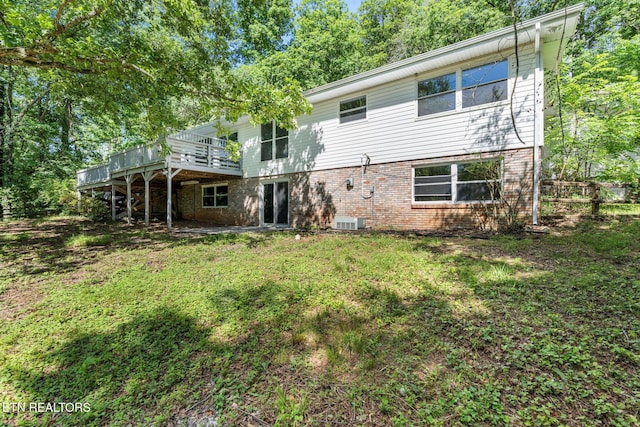 17 Westover Dr, Oak Ridge, TN 37830 - rear view of property with a wooden deck, brick siding, central air condition unit, and a yard