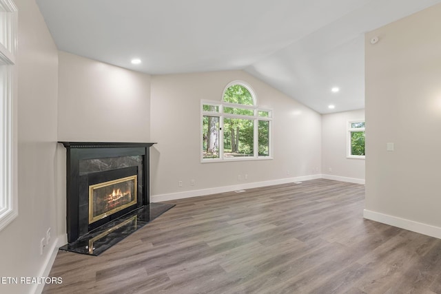 17 Westover Dr, Oak Ridge, TN 37830 - unfurnished living room featuring a premium fireplace, lofted ceiling, wood finished floors, baseboards, and recessed lighting