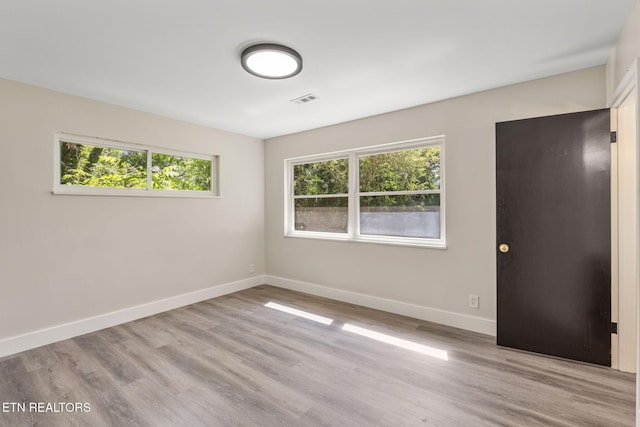 17 Westover Dr, Oak Ridge, TN 37830 - unfurnished room featuring healthy amount of natural light, baseboards, and wood finished floors