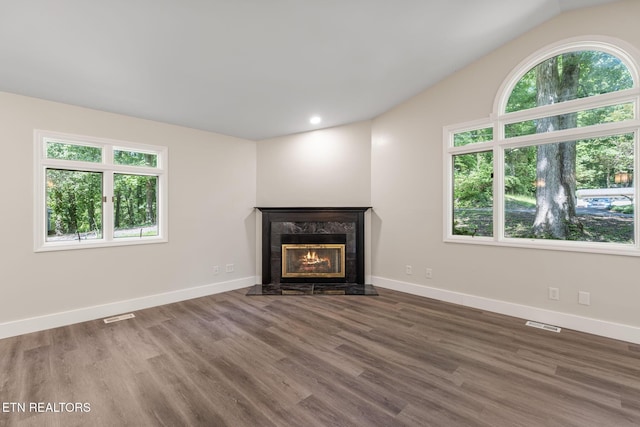 17 Westover Dr, Oak Ridge, TN 37830 - unfurnished living room featuring healthy amount of natural light, wood finished floors, a fireplace, baseboards, and recessed lighting