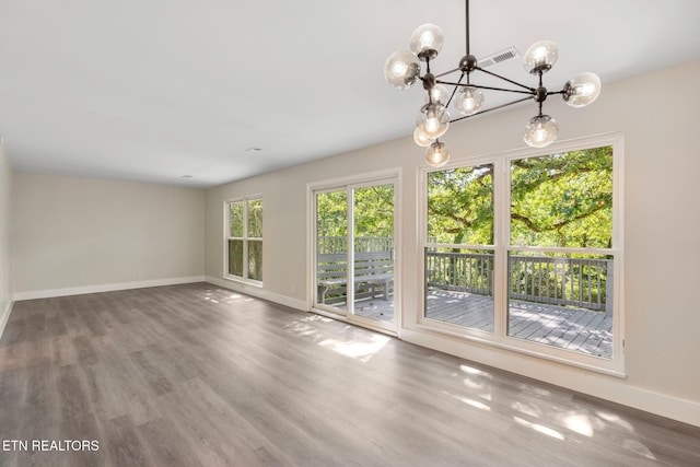 17 Westover Dr, Oak Ridge, TN 37830 - spare room featuring baseboards, a chandelier, and wood finished floors