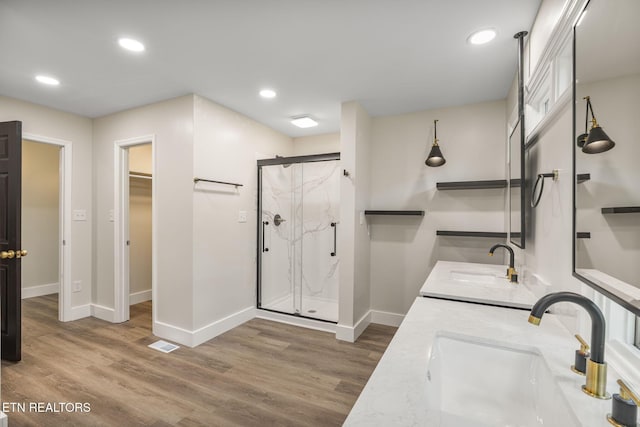 17 Westover Dr, Oak Ridge, TN 37830 - full bath featuring baseboards, wood finished floors, a marble finish shower, a walk in closet, and double vanity