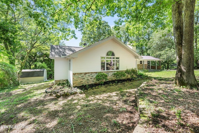 17 Westover Dr, Oak Ridge, TN 37830 - view of home's exterior featuring brick siding and a shingled roof