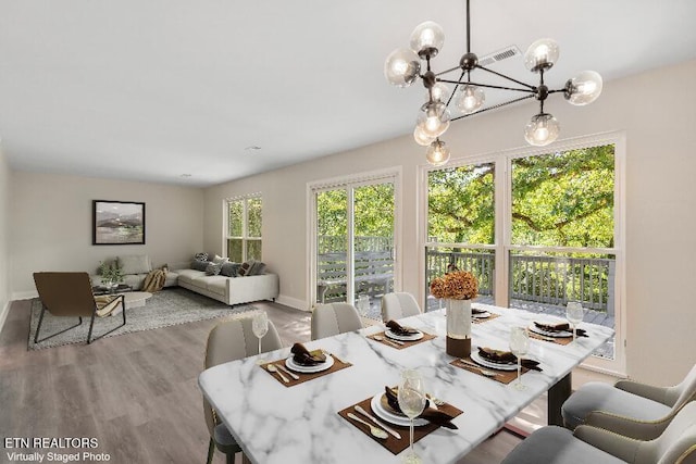 17 Westover Dr, Oak Ridge, TN 37830 - dining space featuring baseboards, wood finished floors, and a chandelier
