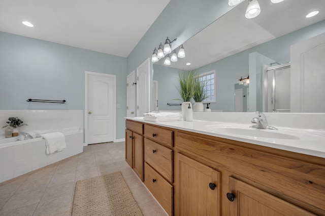 1034 Ridglea Dr, Burns, TN 37029 - full bathroom featuring a stall shower, tile patterned flooring, a garden tub, and double vanity