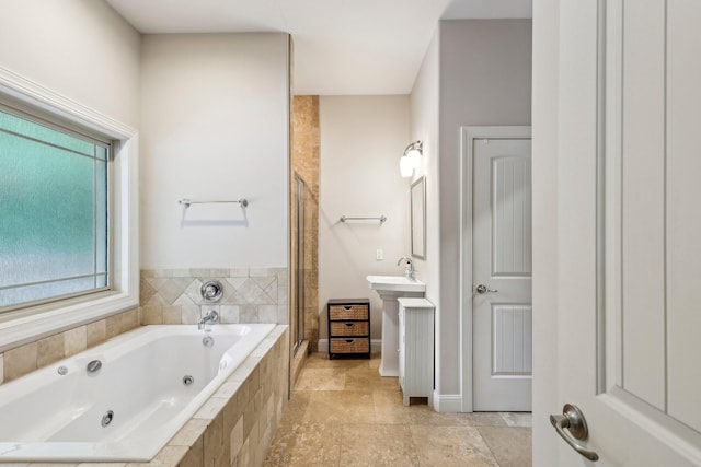 1313 Ridge Rd, Dickson, TN 37055 - bathroom with a shower stall, a whirlpool tub, and baseboards