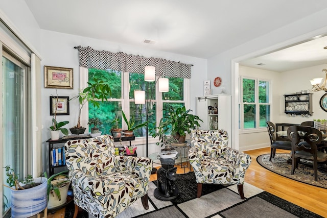 1313 Ridge Rd, Dickson, TN 37055 - living room featuring wood finished floors and a chandelier