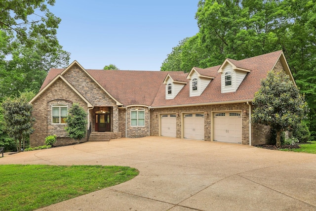 1313 Ridge Rd, Dickson, TN 37055 - view of front facade with driveway, an attached garage, brick siding, and a shingled roof