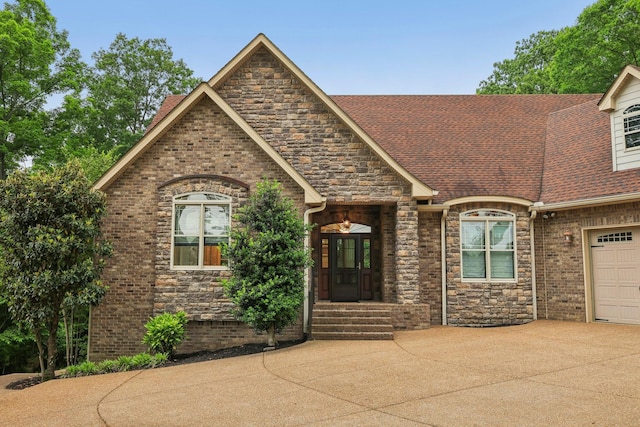 1313 Ridge Rd, Dickson, TN 37055 - view of front facade with driveway, a shingled roof, brick siding, and stone siding