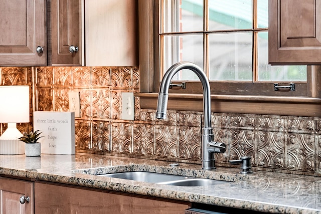 120 Donna Dr, Hendersonville, TN 37075 - kitchen view of a sink, tasteful backsplash, and light stone countertops