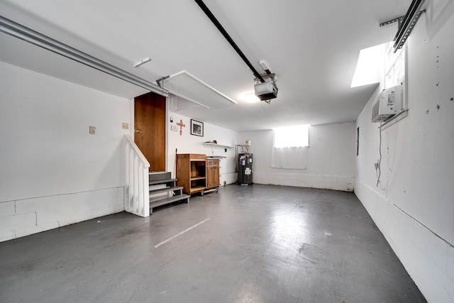 120 Donna Dr, Hendersonville, TN 37075 - garage featuring a garage door opener, water heater, and cooling unit